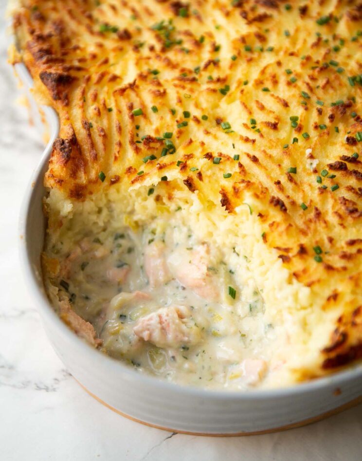 creamy fish pie close up shot of creamy fish pie with portion taken out showing filling